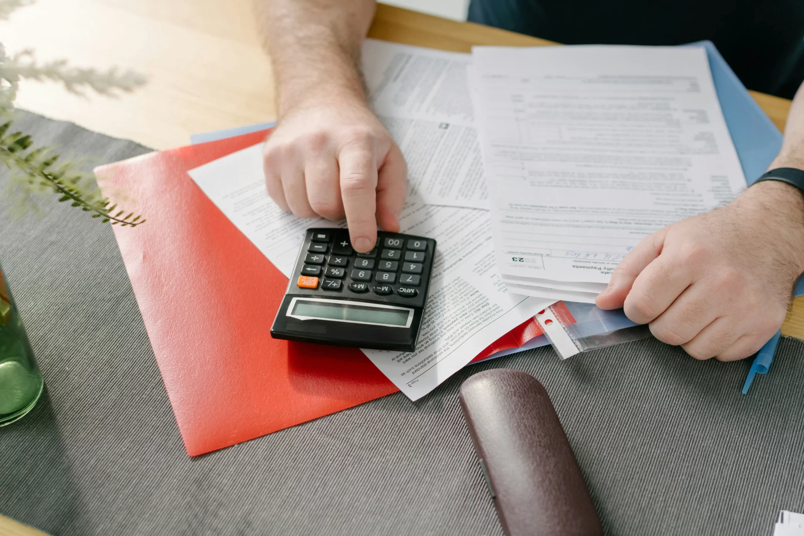 Business owner reviewing postponed VAT accounting figures for a UK VAT return