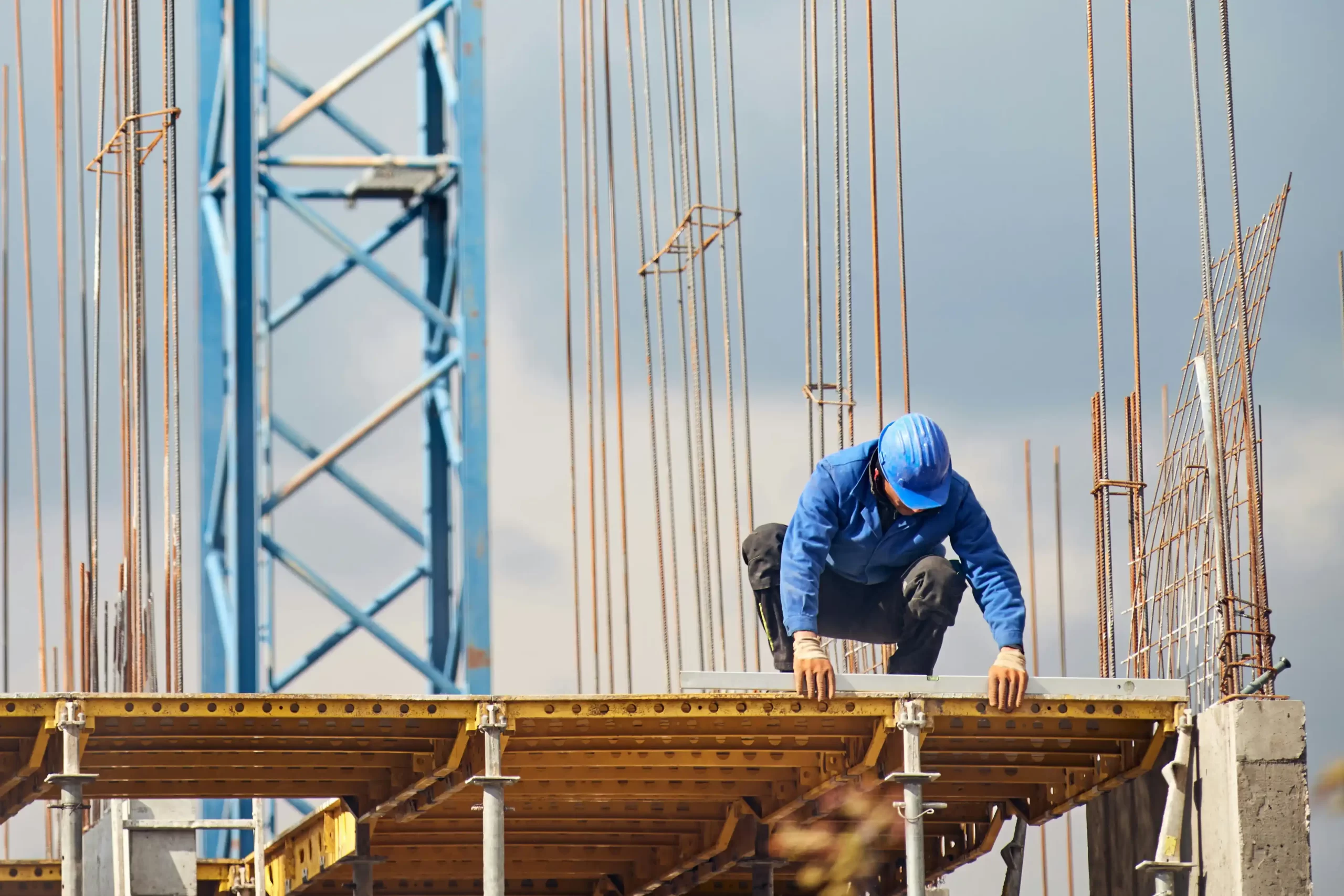 Construction business owner checking reverse charge VAT return records in the UK