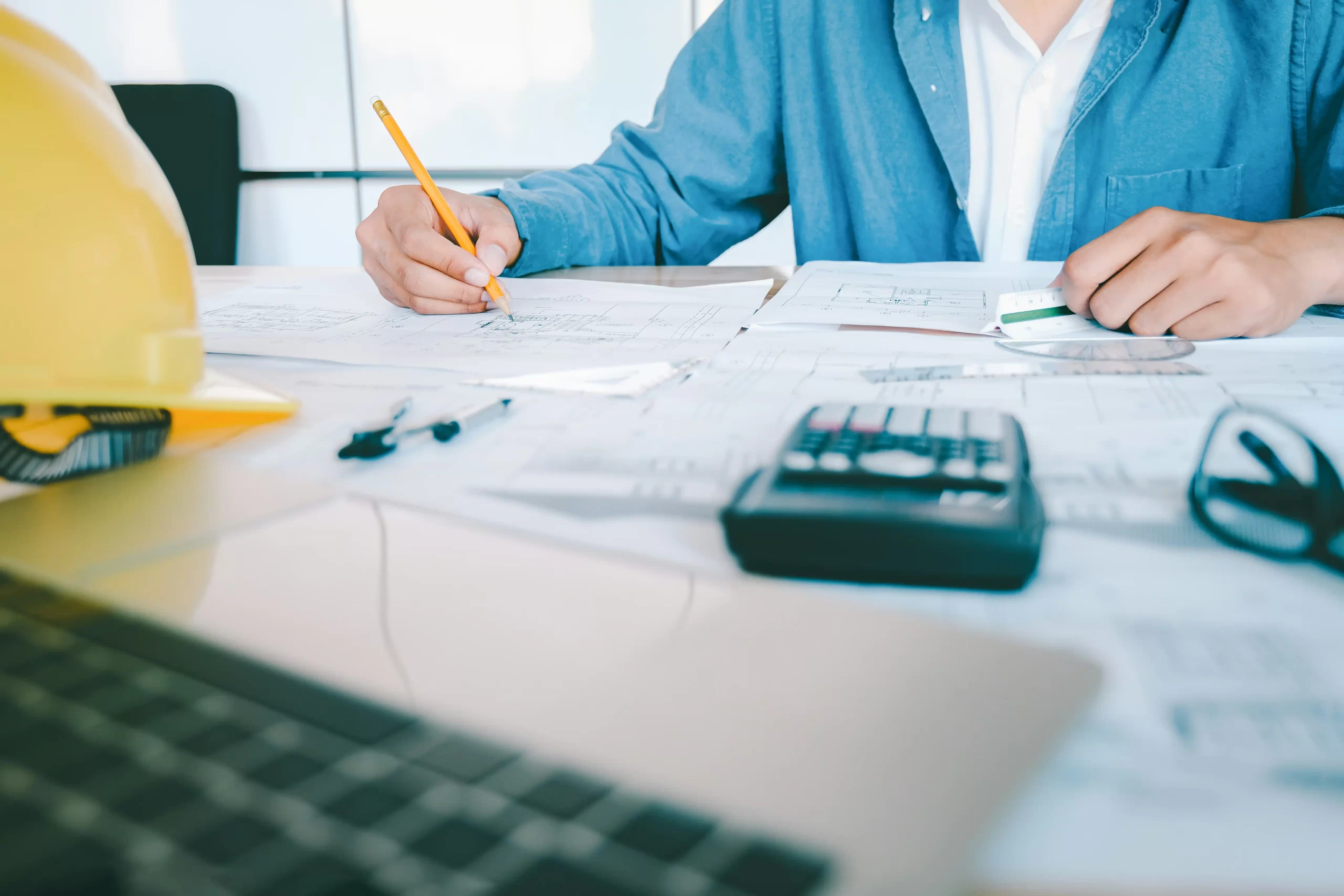 Sole trader reviewing payroll records for their first employee in the UK