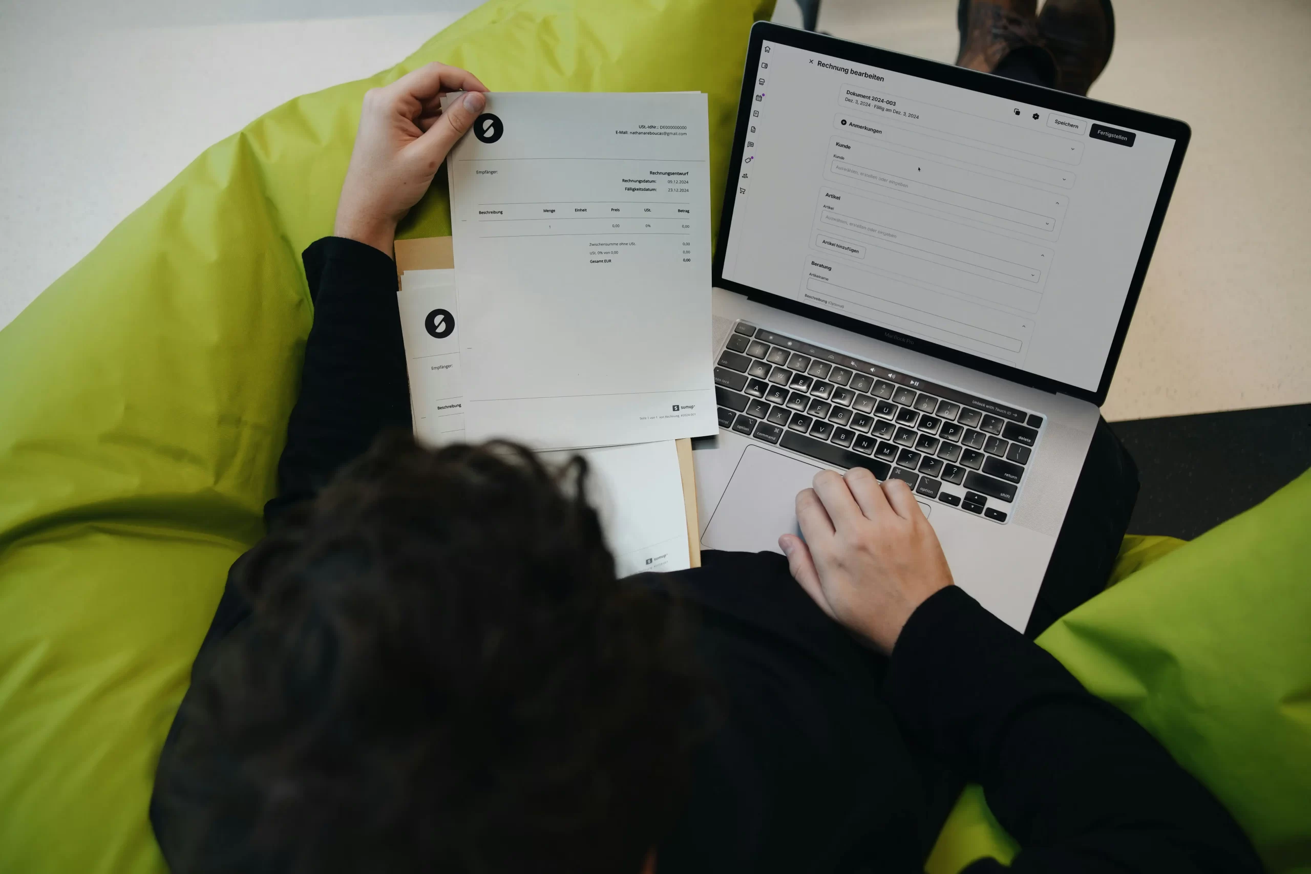 Business owner checking a UK VAT invoice with required details